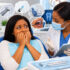 Fear of the dentist showing a nervous patient speaking with a dentist during a consultation
